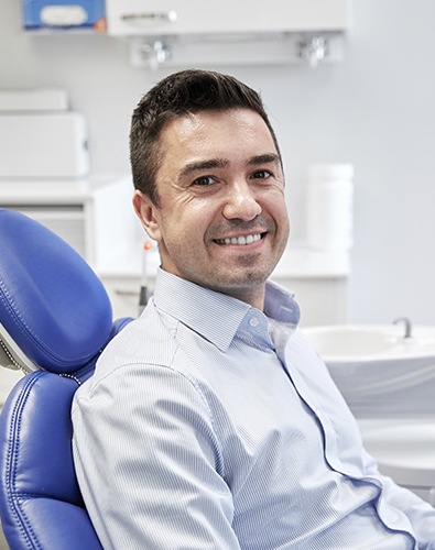 Dental patient smiling in dental chair