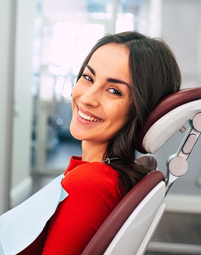 Woman in dental chair  smiling