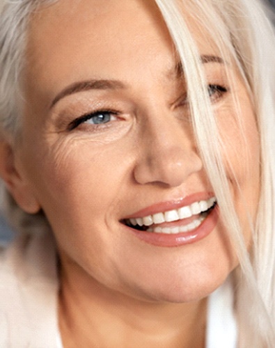 closeup of woman smiling after getting dental implants in Denton