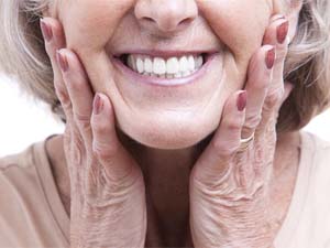 Closeup of smiling woman with dental implants in Denton