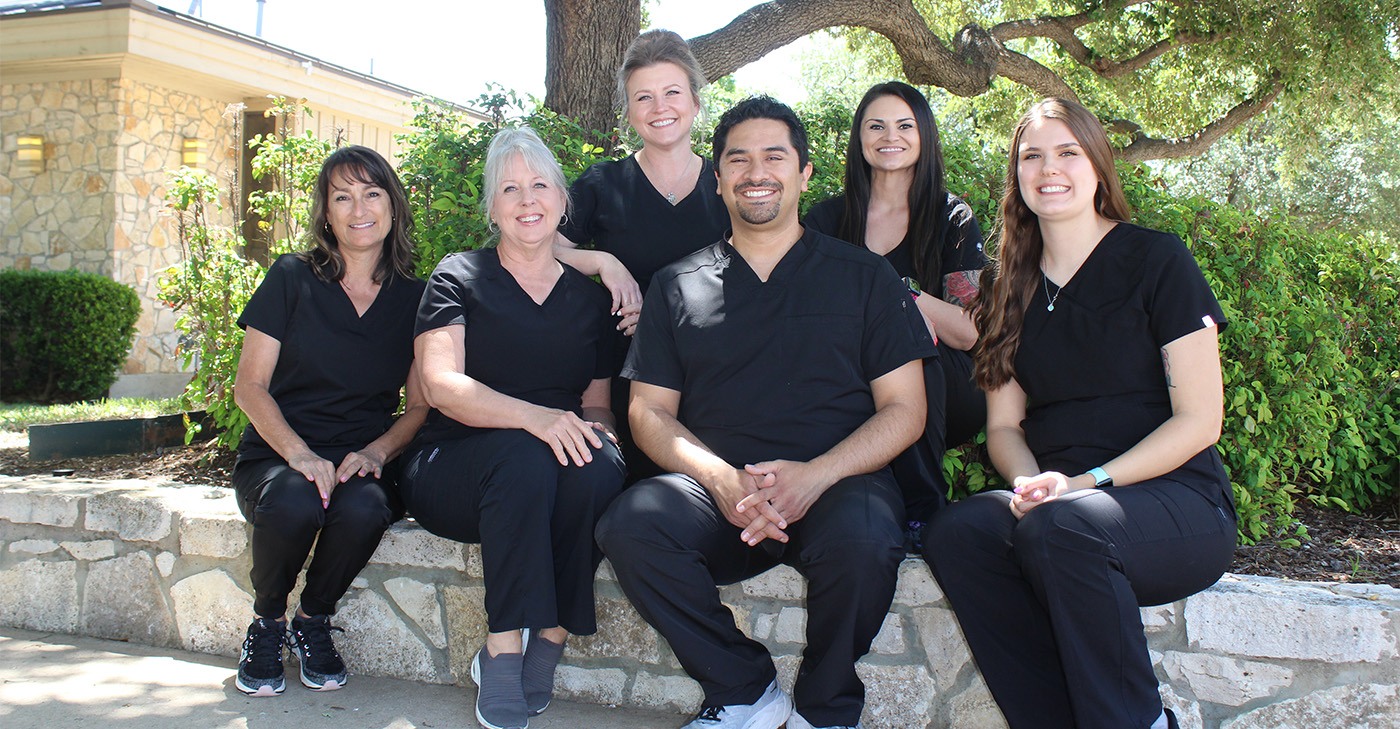 Smiling dentist and dental team in Denton outdoors