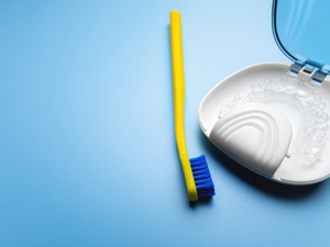 Invisalign clear aligner in case with toothbrush