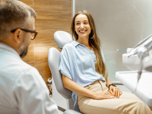 Lady smiles at dentist