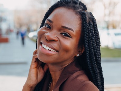 Woman with flawless smile after cosmetic dentistry