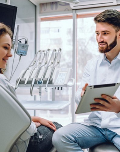 Woman smiling at dentist in Denton