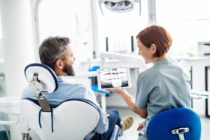 Denton dentist and patient talking during dental checkup