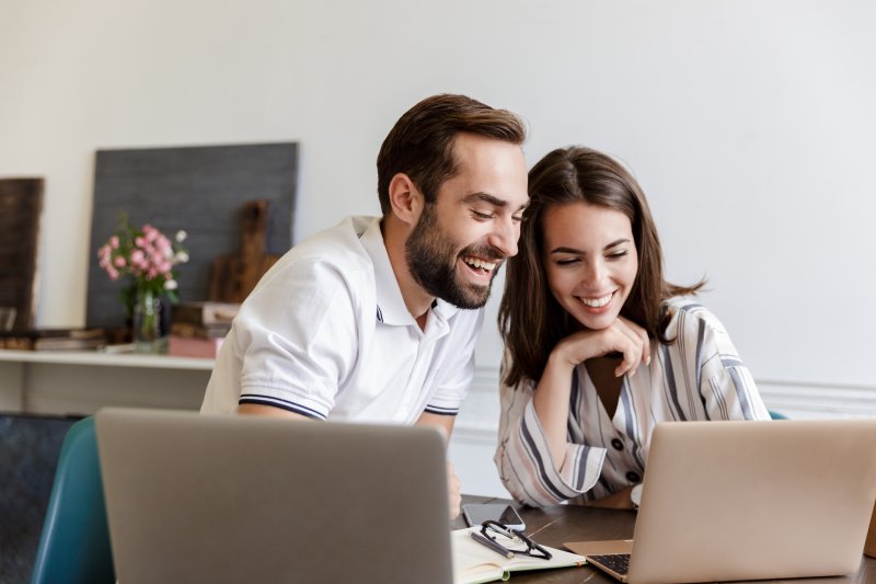 Couple smiling while looking at camera