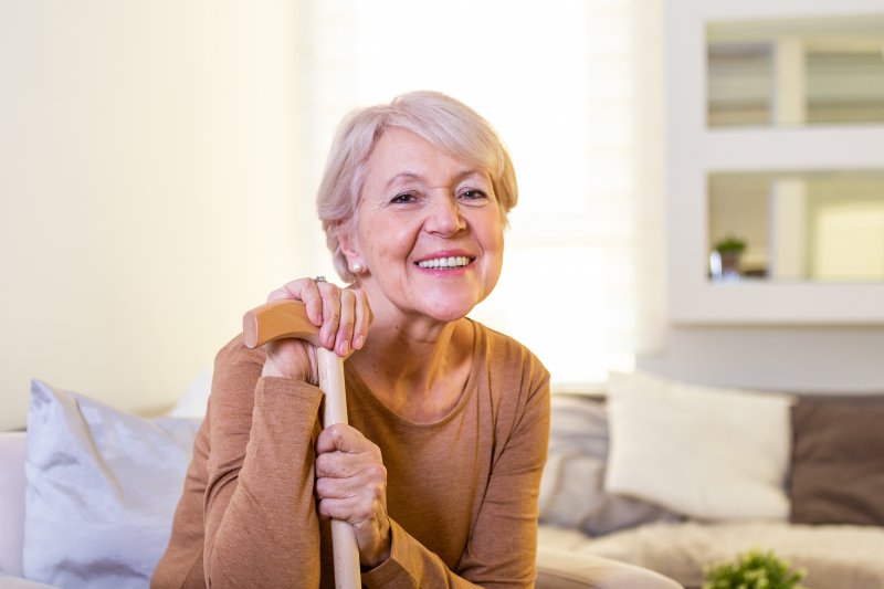 woman smiling with dentures in Denton