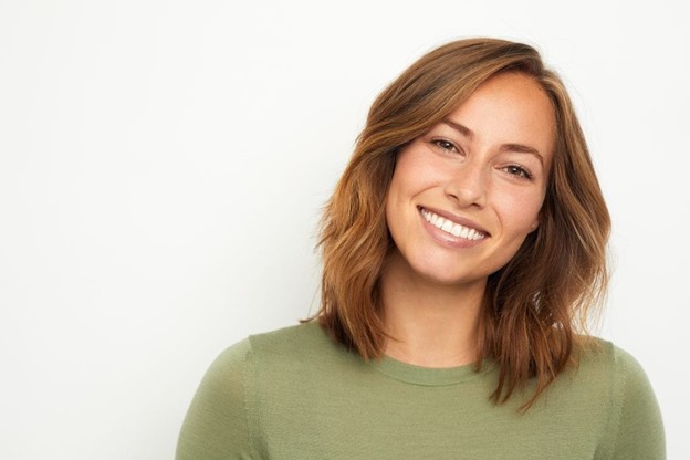 person with dental implants smiling