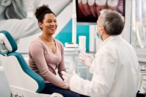 a patient speaking with their dentist