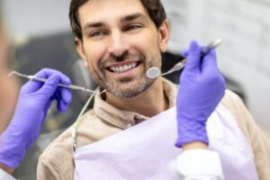 Man smiling during his dental checkup